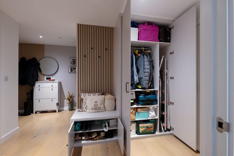 Wardrobe in hallway with doors open