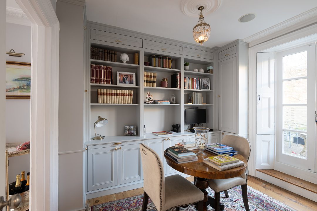 Built in cupboards with shelving units for books