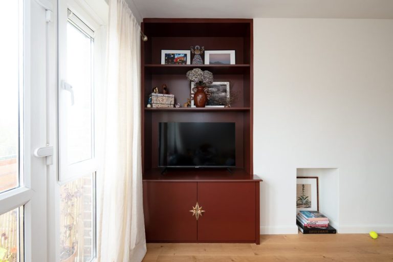 Red painted alcove cabinet with shelving