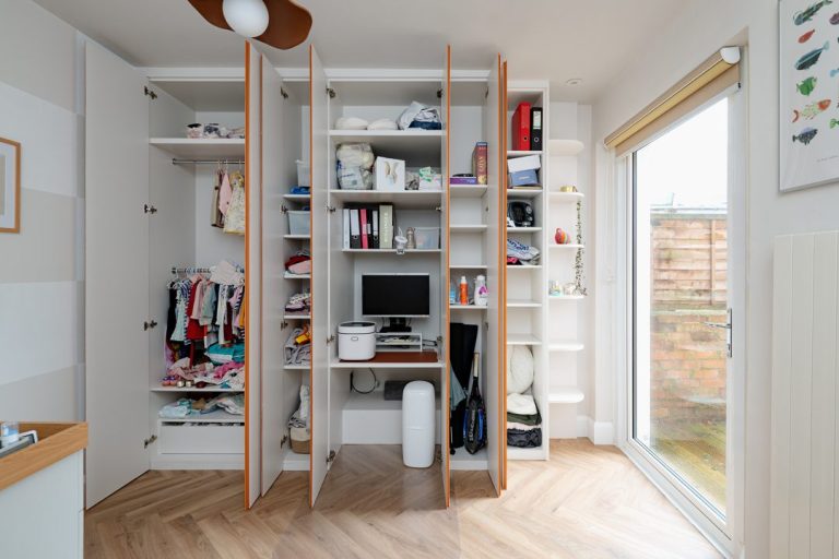 Shelves and rail inside a bespoke wardrobe