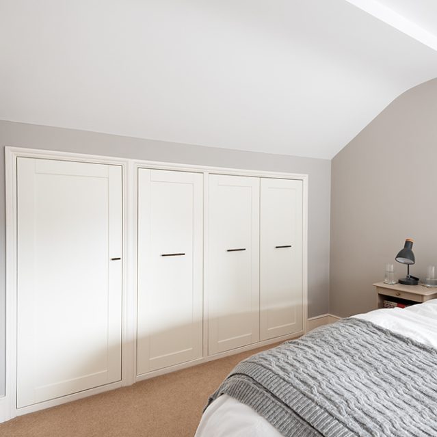 Built-in under eaves wardrobe in bedroom