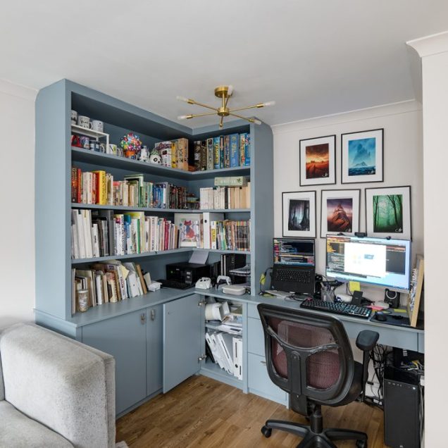 Fitted corner home office unit with desk, shelving and cupboards.