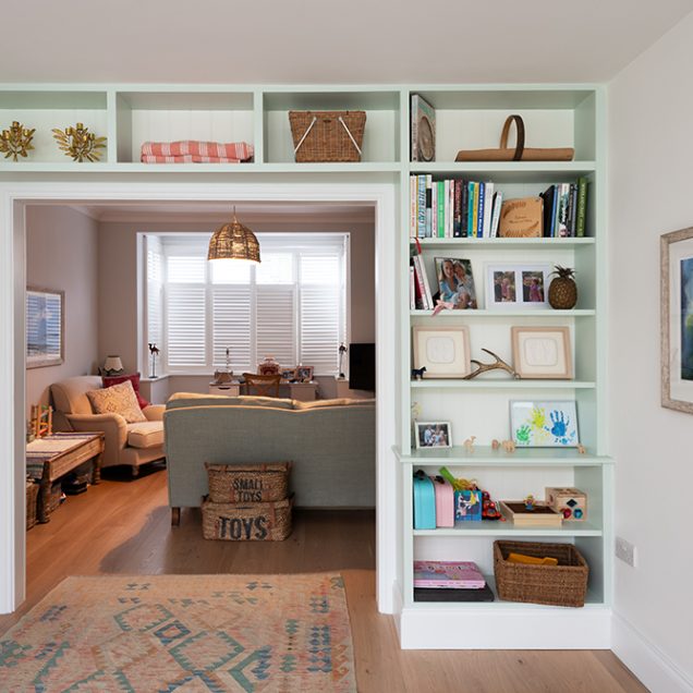 White built-in shelving unit in living room